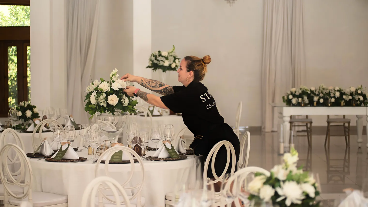 Planner styling reception tables with white florals