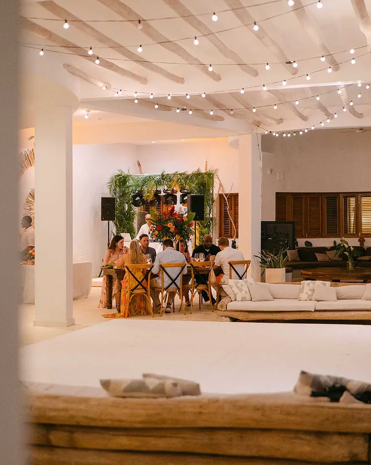 Evening lounge and dance floor set up under string lights